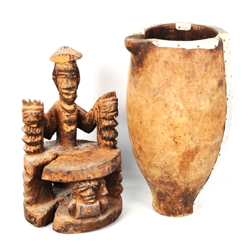 1025 - African Tribal carved and painted wood figure, height 26cm, and a wooden water pot with aluminium mo... 