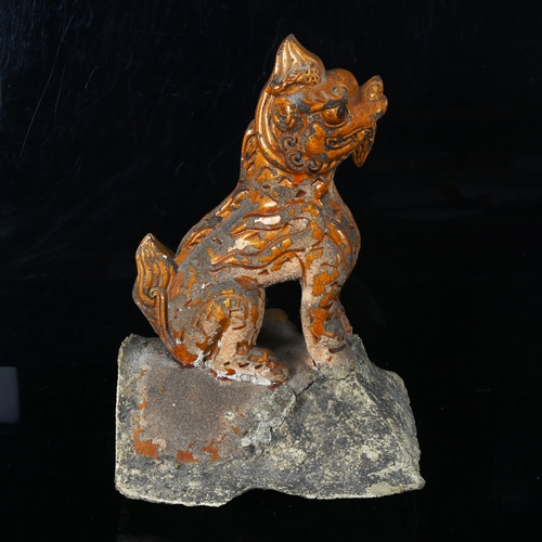 1035 - A Chinese Tang Dynasty yellow glaze pottery lion roof tile, height 33cm