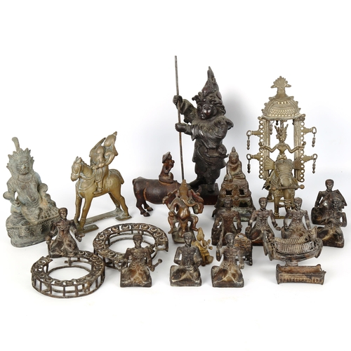 1040 - A collection of Indian bronzes, including a band of musicians, Buddhas, and standing figures