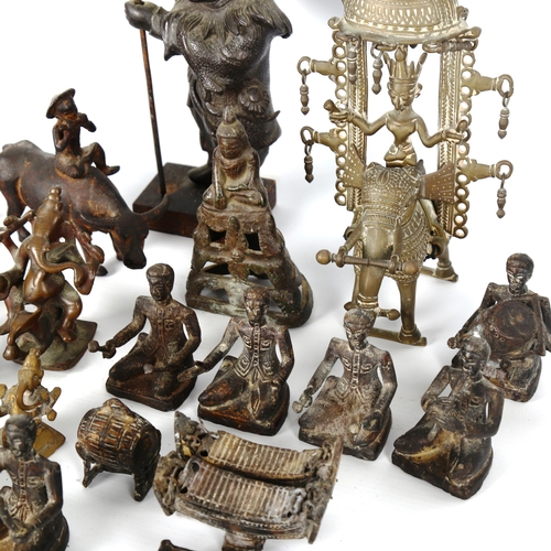 1040 - A collection of Indian bronzes, including a band of musicians, Buddhas, and standing figures