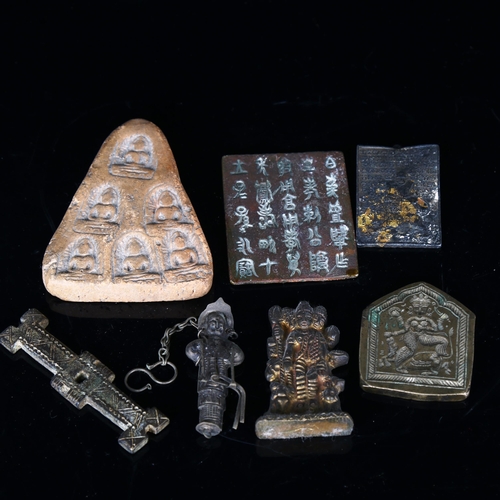 1042 - A group of Oriental artefacts, including bronze plaques, a gilt-bronze Buddha plaque etc (7)