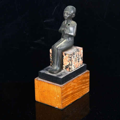 1043 - Egyptian patinated bronze seated pharaoh on wood and marble block base, probably early 20th century,... 