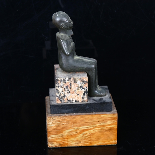 1043 - Egyptian patinated bronze seated pharaoh on wood and marble block base, probably early 20th century,... 