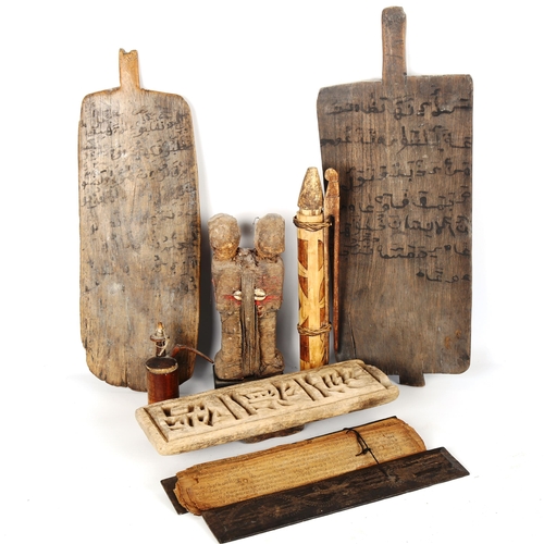 1046 - A group of African and Islamic wood artefacts, including 2 text school boards, length 46cm