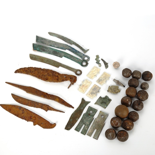 1047 - ANTIQUITIES - a collection of early Chinese knife money, and a collection of early bullet money