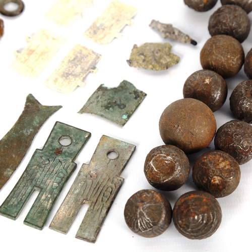 1047 - ANTIQUITIES - a collection of early Chinese knife money, and a collection of early bullet money