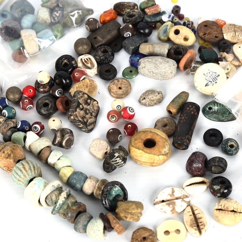 1056 - ANTIQUITIES - a collection of early ceramic and glass beads