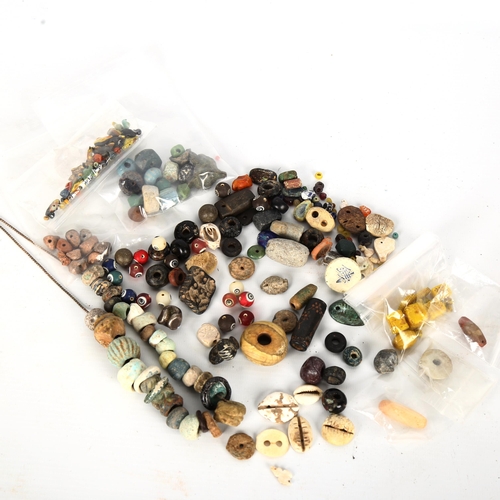 1056 - ANTIQUITIES - a collection of early ceramic and glass beads