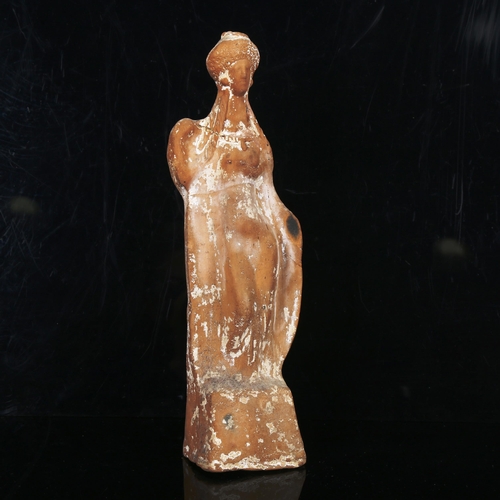 1070 - A Greek terracotta standing figure of a goddess, height 31cm