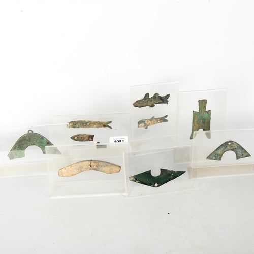 1081 - A small collection of Chinese bronze money on perspex stands