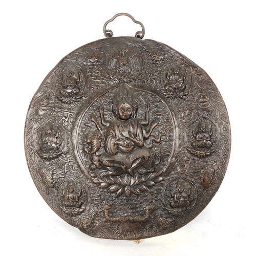 1084 - 19th century Indian brass wall plaque, with relief embossed panels depicting various gods, diameter ... 