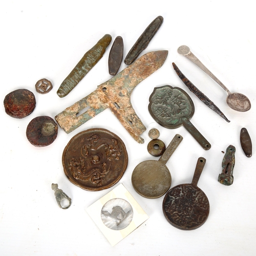 1100 - ANTIQUITIES - a group of miniature Chinese bronze mirrors etc