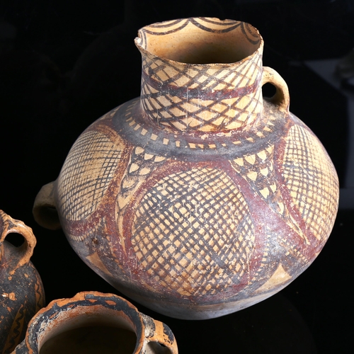 1108 - 4 early Greek terracotta pots with painted decoration, largest height 22cm