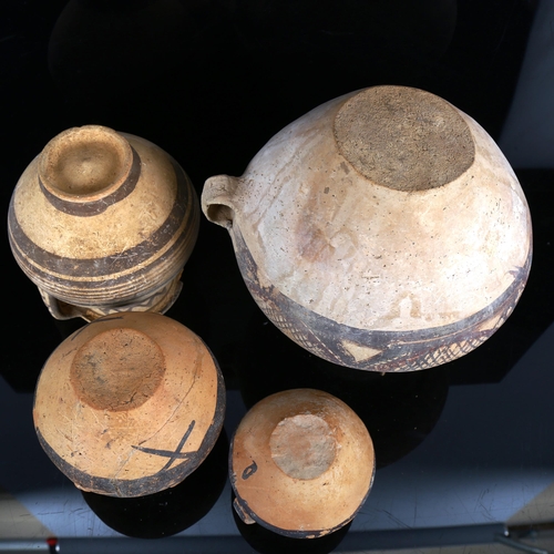 1108 - 4 early Greek terracotta pots with painted decoration, largest height 22cm