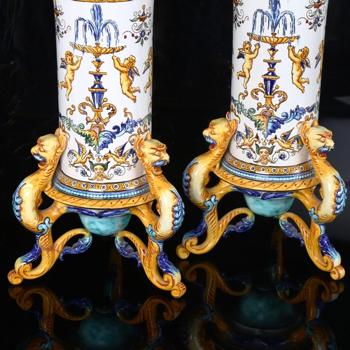 1123 - A pair of Italian faience pottery cylindrical vases, with hand painted Classical designs, on griffon... 