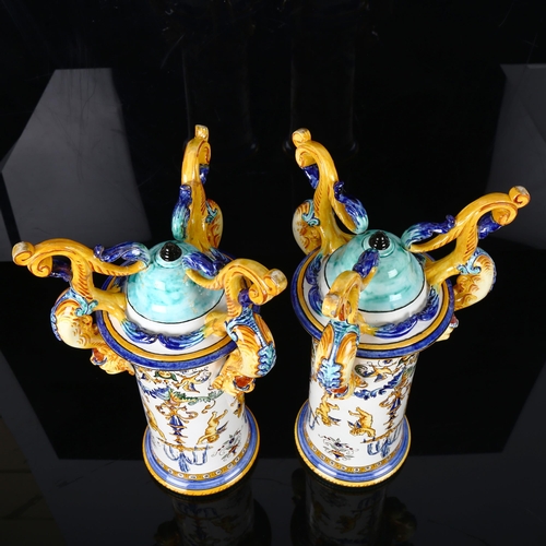 1123 - A pair of Italian faience pottery cylindrical vases, with hand painted Classical designs, on griffon... 