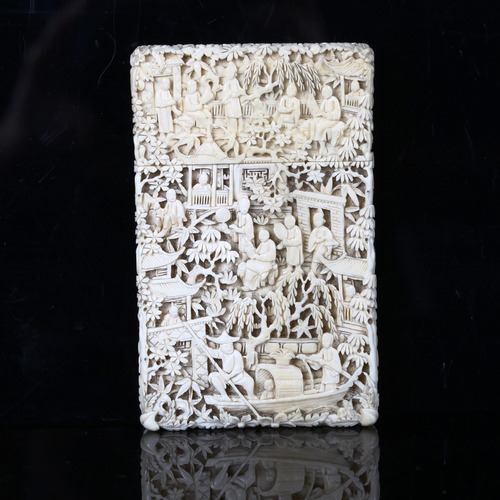 1126 - A Chinese Canton ivory card case, late 19th/early 20th century, finely detailed relief carved river ... 