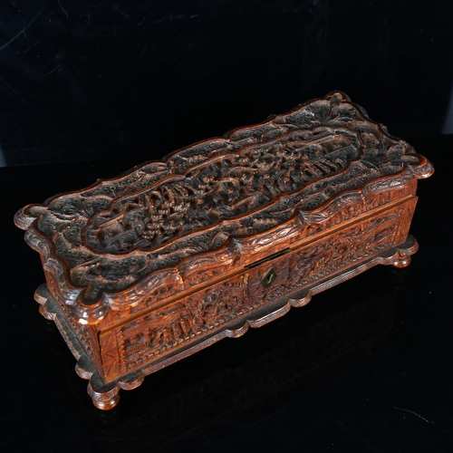 1128 - A 19th century Chinese wooden box of rectangular form, finely detailed allover relief carved panels,... 