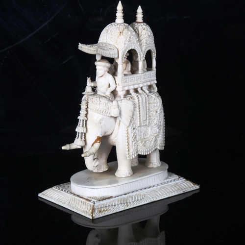 1129 - 19th century Indian carved ivory caparisoned elephant and riders, finely carved allover, height 16cm