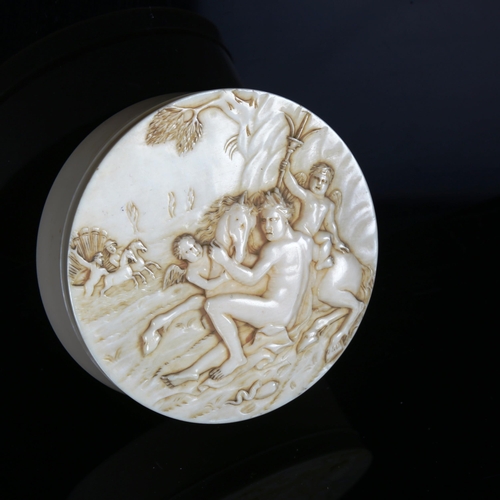 1133 - A French circular ivory box, 18th or 19th century, the lid carved in relief depicting satyres, diame... 