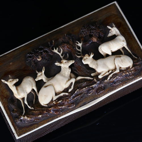 1143 - A 19th century Bavarian staghorn snuffbox, relief carved lid depicting deer in woodland, 10cm x 5.5c... 