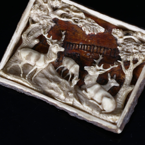 1144 - A 19th century Bavarian staghorn brooch, with relief carved design of stags in woodland, 6cm x 4.5cm