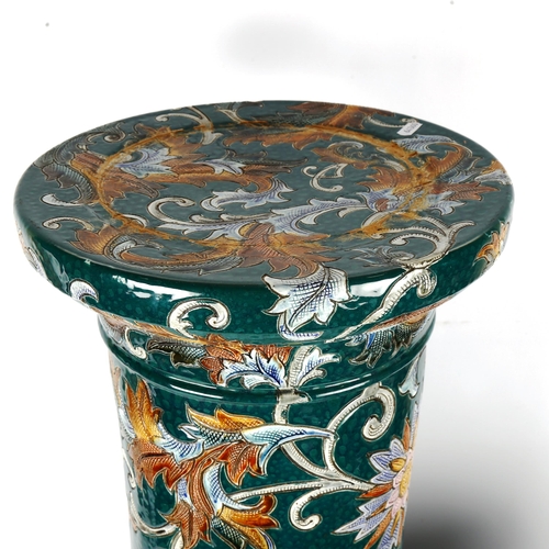 1153 - A Majolica pottery jardiniere on pedestal circa 1900, with grotesque mask handles and incised leaf d... 