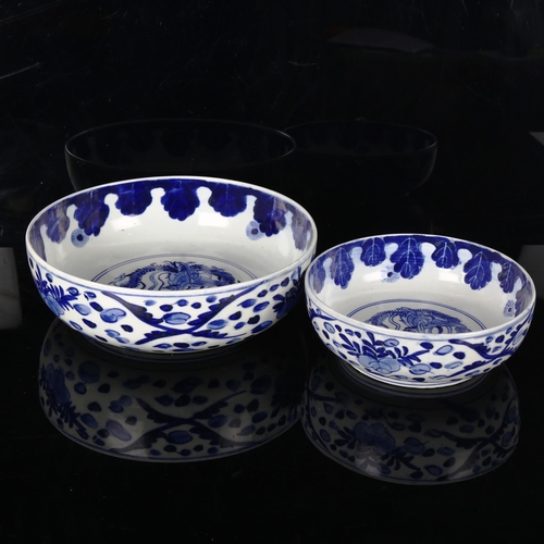 1161 - A graduated pair of Chinese blue and white porcelain bowls, with Ho Ho bird designs, diameter 25cm a... 