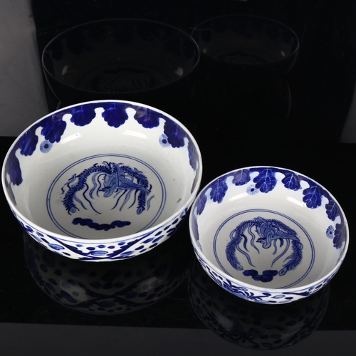 1161 - A graduated pair of Chinese blue and white porcelain bowls, with Ho Ho bird designs, diameter 25cm a... 