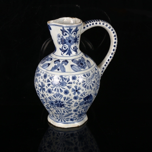 1163 - An Antique Delft tin-glaze pottery jug, 18th or 19th century, with hand painted decoration, signed u... 