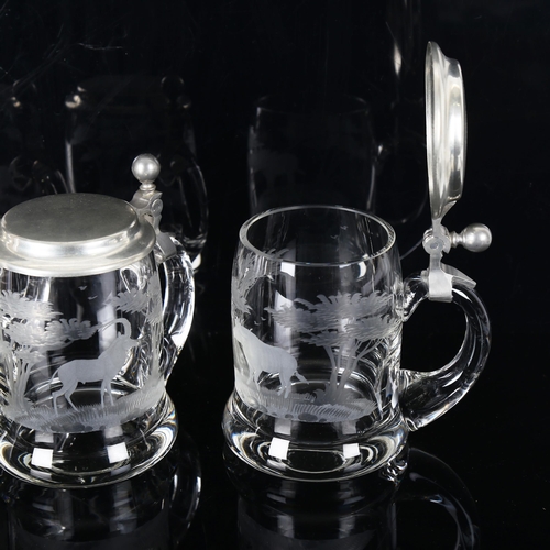 1166 - 4 Rowland Ward clear glass tankards with pewter lids, each engraved with a safari animal, thought to... 