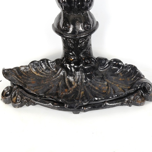 1179 - A cast-iron stick stand in the form of a dog holding a riding crop, with removeable tray base