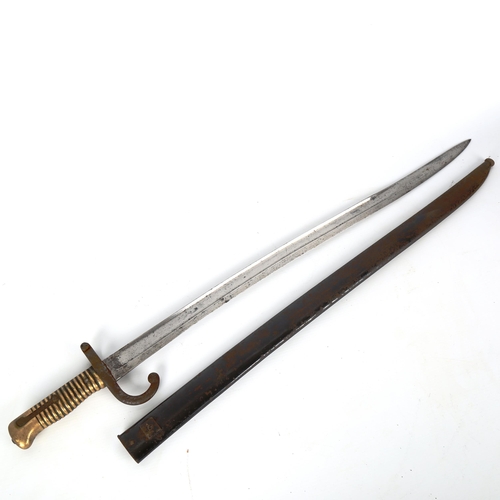 1184 - A 19th century French sword bayonet, with brass hilt and metal scabbard