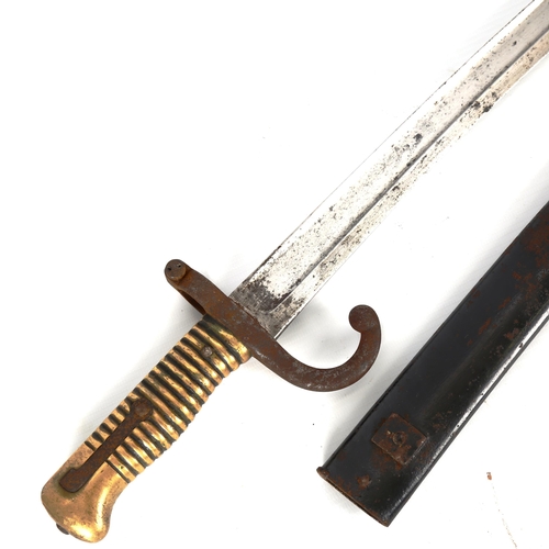 1184 - A 19th century French sword bayonet, with brass hilt and metal scabbard