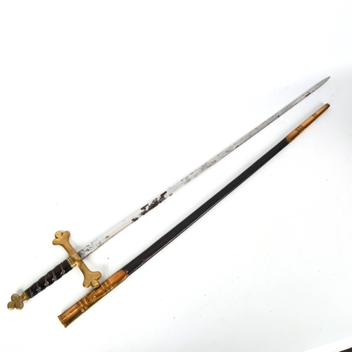 1185 - A Masonic ceremonial sword, with brass cross hilt and brass-mounted leather scabbard, in original wo... 