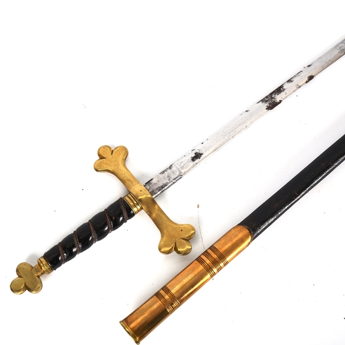 1185 - A Masonic ceremonial sword, with brass cross hilt and brass-mounted leather scabbard, in original wo... 