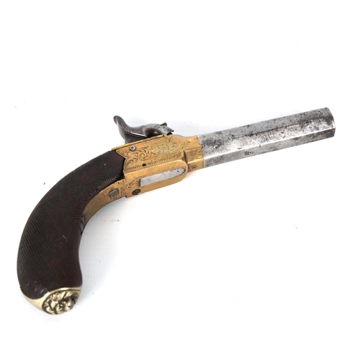 1192 - An 18th century percussion pocket pistol, with engraved brass lock and carved handle, length 19cm