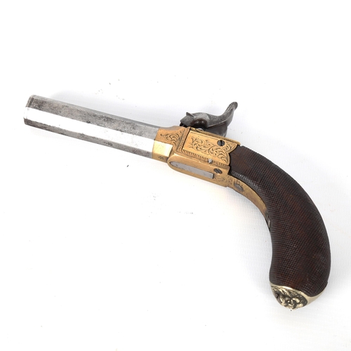 1192 - An 18th century percussion pocket pistol, with engraved brass lock and carved handle, length 19cm