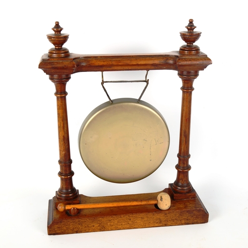 1199 - A Victorian oak-framed dinner gong with turned columns, height 39cm, width 31cm