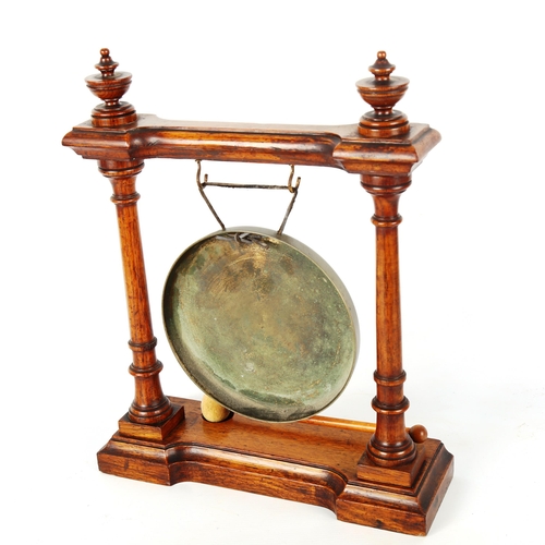 1199 - A Victorian oak-framed dinner gong with turned columns, height 39cm, width 31cm