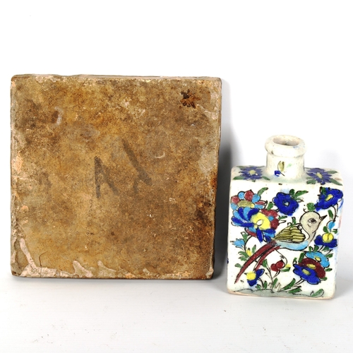 1201 - An Islamic faience glazed pottery tile, with painted decoration, 20cn x 20cm, and a similar painted ... 