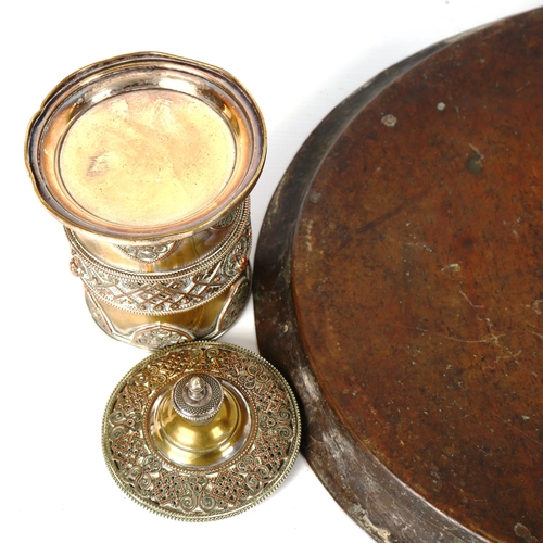 1202 - A Middle Eastern engraved brass oval tray, width 48cm, and a 19th century cylindrical pot and cover,... 