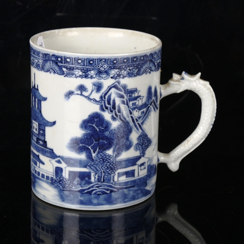 1208 - A Chinese blue and white porcelain mug, with dragon design handle, height 13cm, diameter 11cm