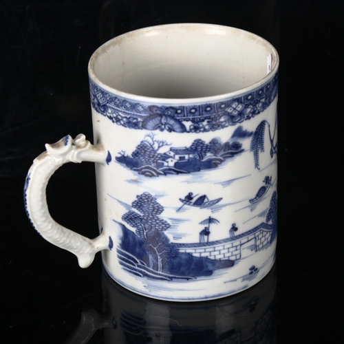 1208 - A Chinese blue and white porcelain mug, with dragon design handle, height 13cm, diameter 11cm