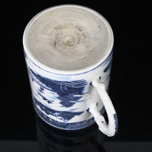 1208 - A Chinese blue and white porcelain mug, with dragon design handle, height 13cm, diameter 11cm