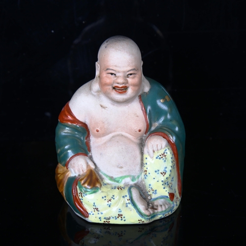 1210 - A Chinese porcelain seated Buddha, impressed marks under base, height 8cm