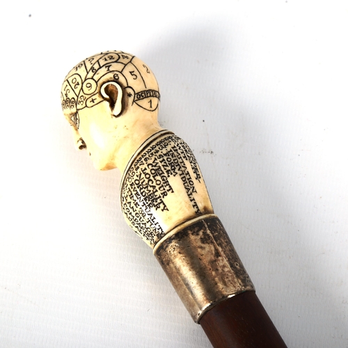 1218 - A 19th century phrenology walking stick, with carved ivory handle and silver ferrule, hallmarks Lond... 