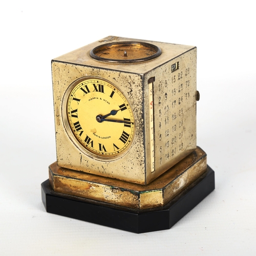 1221 - An Art Deco Mappin & Webb revolving cube-shaped combination desk compendium, comprising clock, calen... 