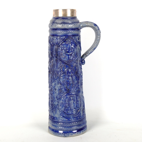 1222 - A 19th century blue glaze stoneware stein, with relief moulded panels and silver rim, hallmarks Lond... 