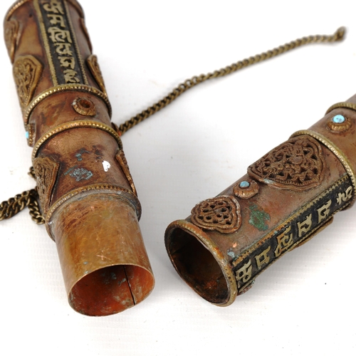 1224 - A Tibetan stone set copper scroll holder, with applied brass mounts, length 40cm